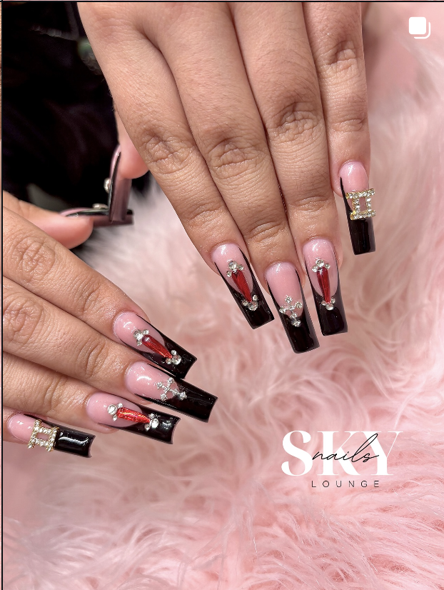 Black and red french tips with gold gem charms